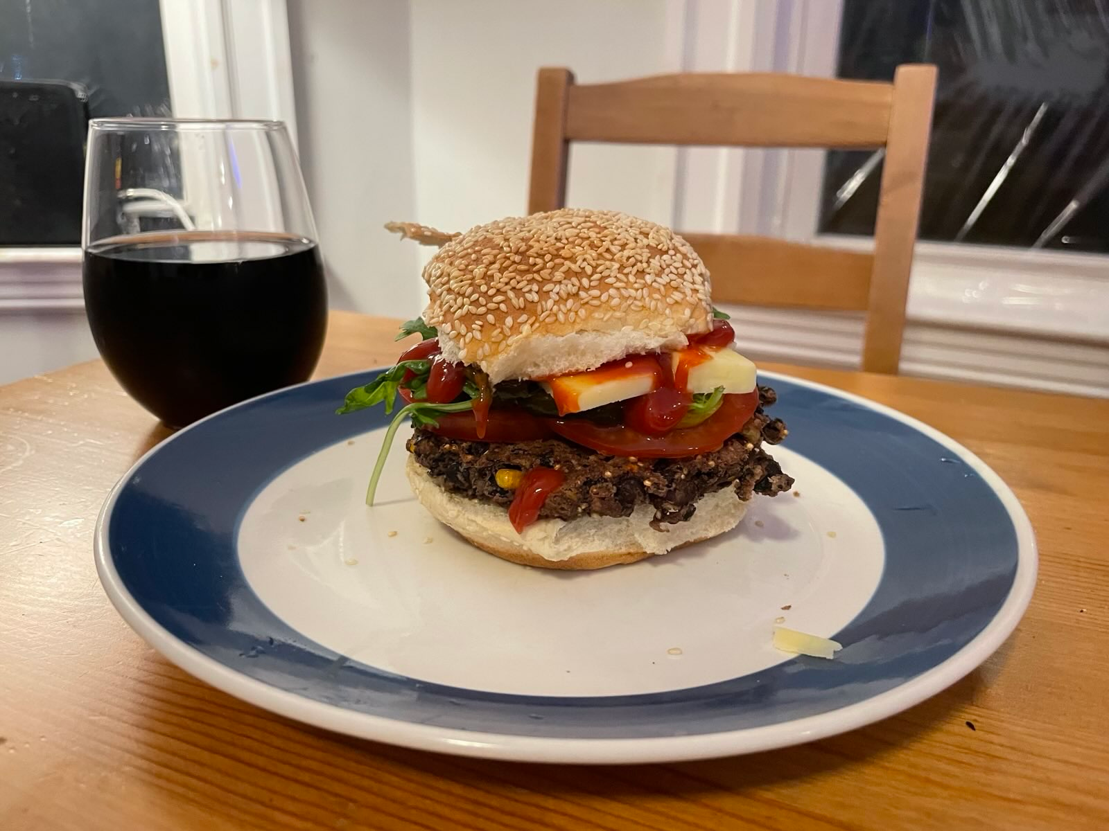 homemade bean burger with optional cheese and salad on the side