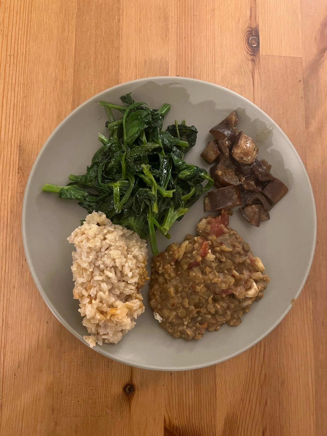 brown rice, pea shoots with garlic, red lentil dal, eggplant