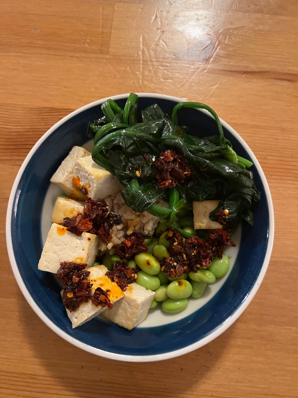 tofu, edamame, yu choy, brown rice topped with chili crisp